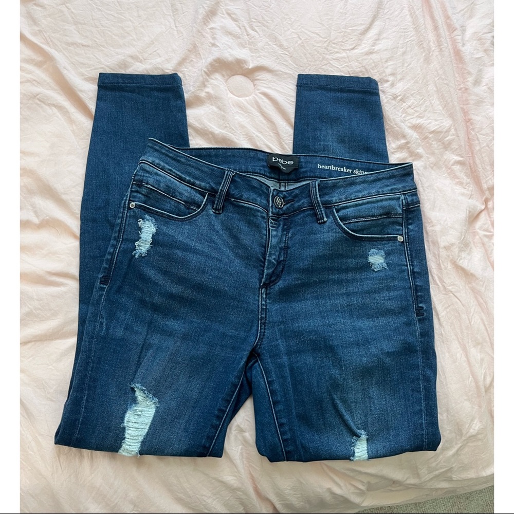 Bebe skinny jeans with rips